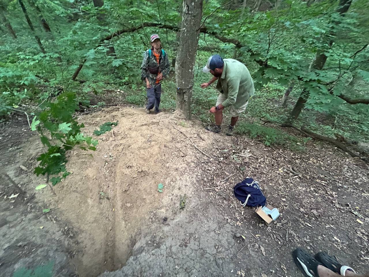 Installing a camera trap near badger setts.